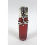 An Arts & Crafts silver mounted scent bottle, influenced by the designs of Archibald Knox and