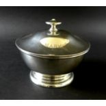 A George V silver circular lidded bowl, with 'MARY' engraved upon its lid, raised upon a circular