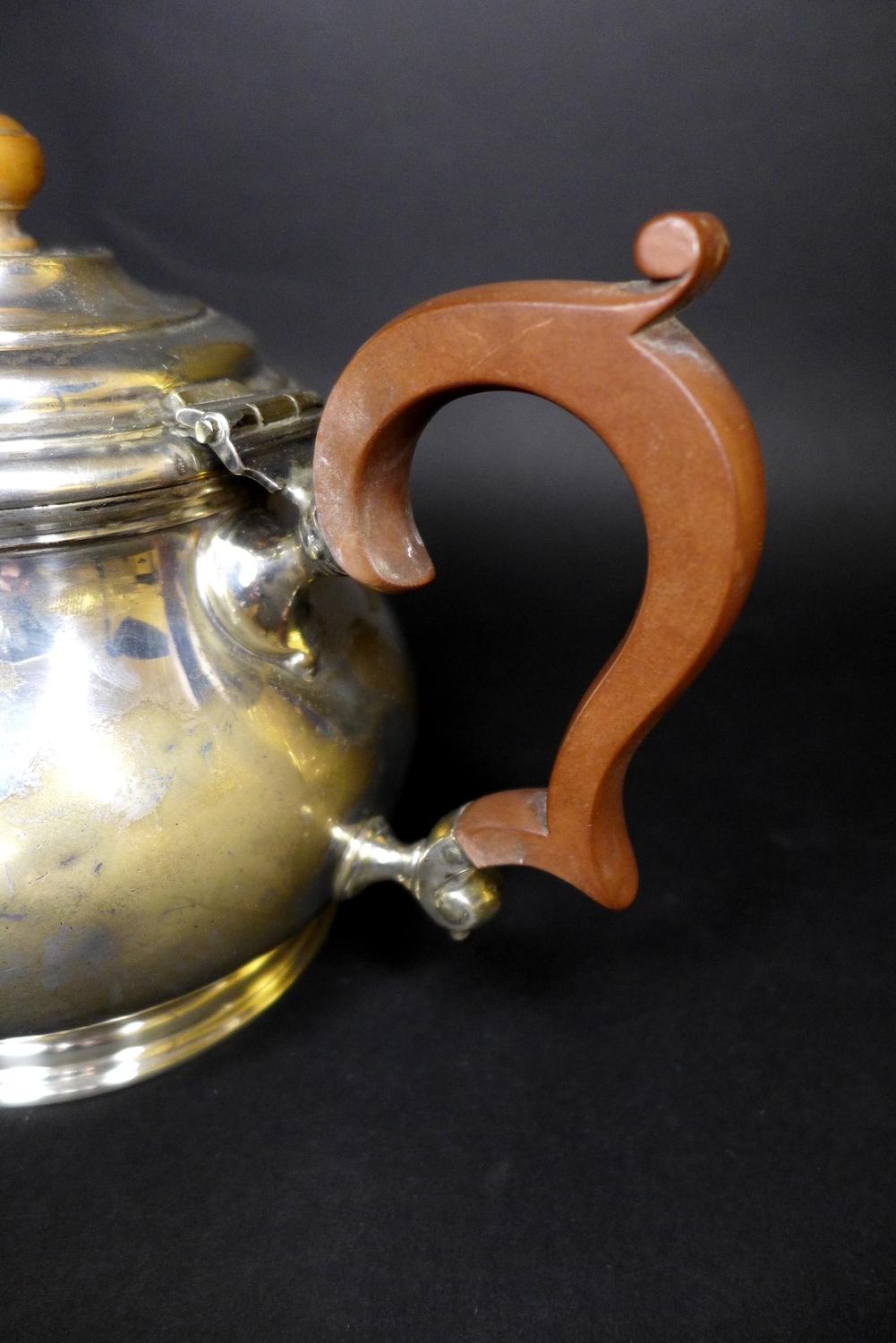 A George V silver teapot, of squat circular form, with ebonised handle and walnut finial, Adie Bros, - Image 8 of 9