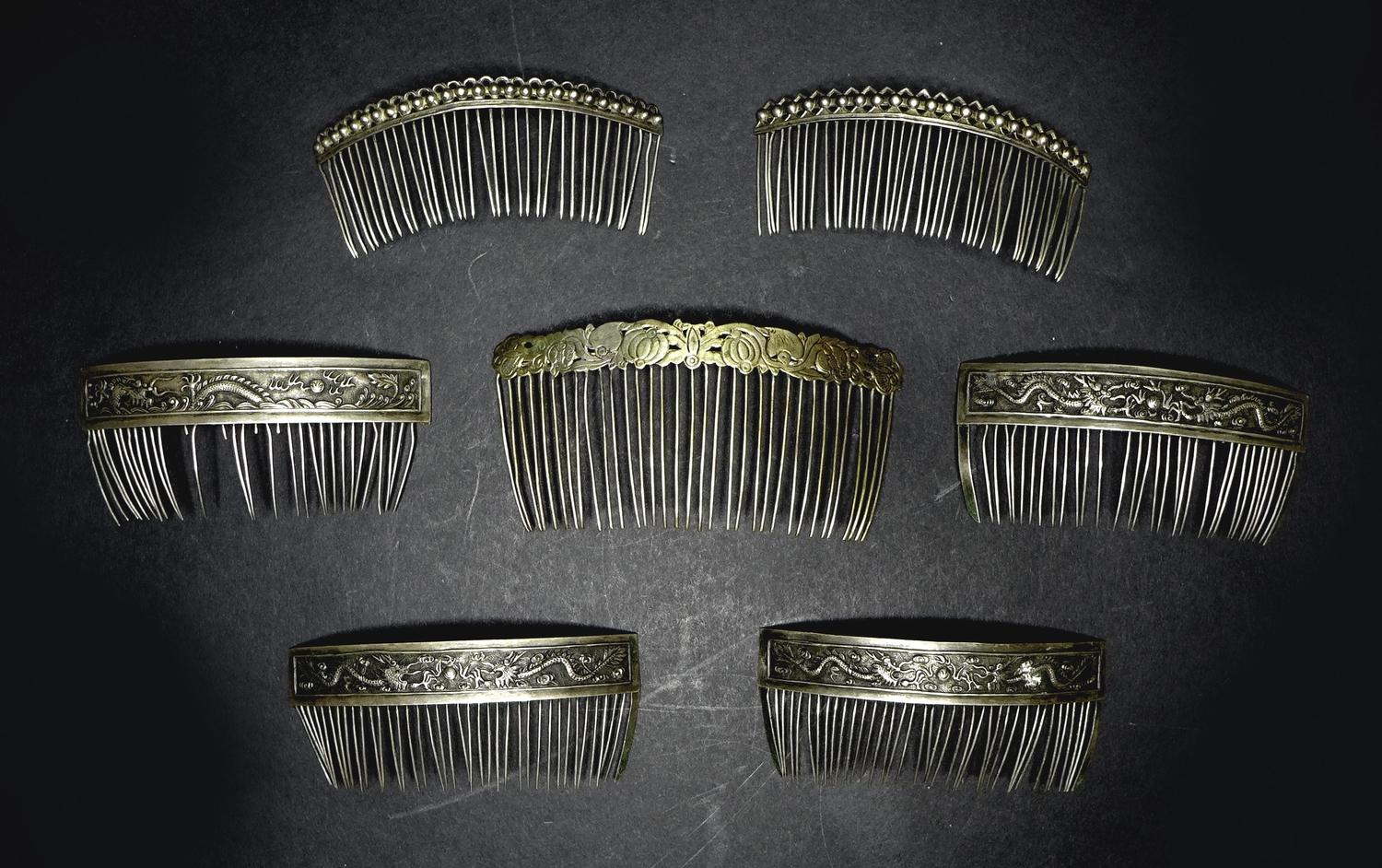 A group of five 19th century Chinese white metal hair clips, comprising a quartet stamped with a