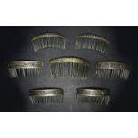 A group of five 19th century Chinese white metal hair clips, comprising a quartet stamped with a