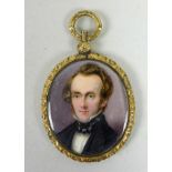 A Victorian oval portrait miniature, half length, depicting a Victorian gentleman with blue