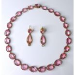 A late Georgian pale pink paste demi-parure, circa 1825, comprising a riviere necklace of twenty