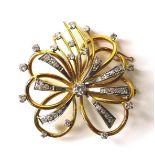 A French diamond, 18ct yellow and white gold brooch, formed as a flower, with hollow wire petals,