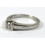 A platinum and diamond solitaire ring, the 0.2ct diamond in a deep V setting with bars to either