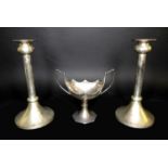 A pair of Elizabeth II silver candlesticks, each with flared single knop tops and conical bases,