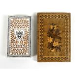 Two 19th century card cases, one with fretwork carved and engraved ivory centred by a heart, on a