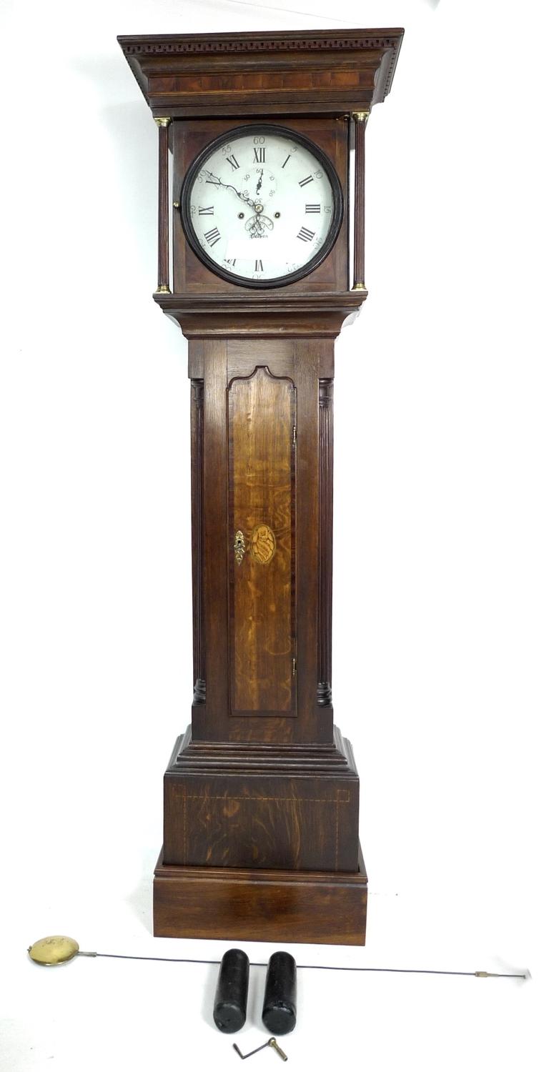 An early 19th century mahogany and oak long case clock, circular white enamel dial signed Deacon