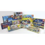 A collection of eleven opened 1980s early 1990s Lego and Technical Lego part sets with original