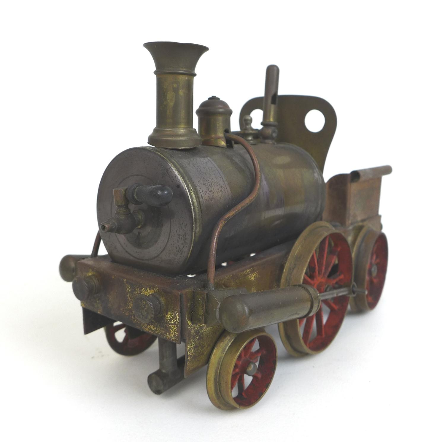 A live steam spirit fuelled 2-2-2 locomotive, possibly Stevens Model Dockyard or similar with twin