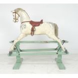 An Edwardian G & J Lines extra carved rocking horse, painted dapple grey horse with brown leather