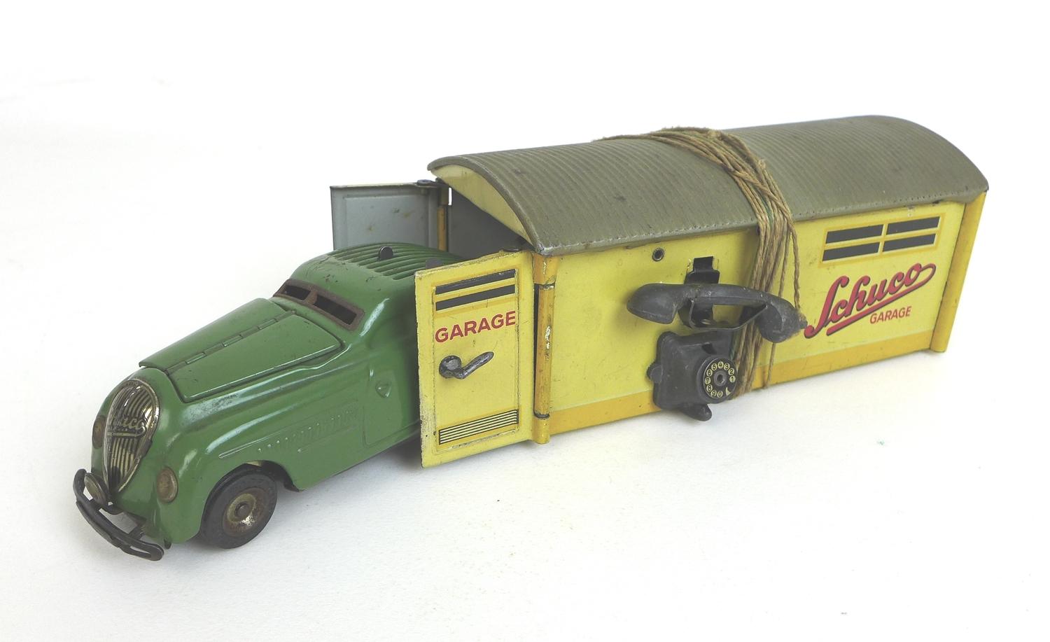 A Schuco clockwork streamline garage with car, the garage 'No 1500' complete with telephone lever