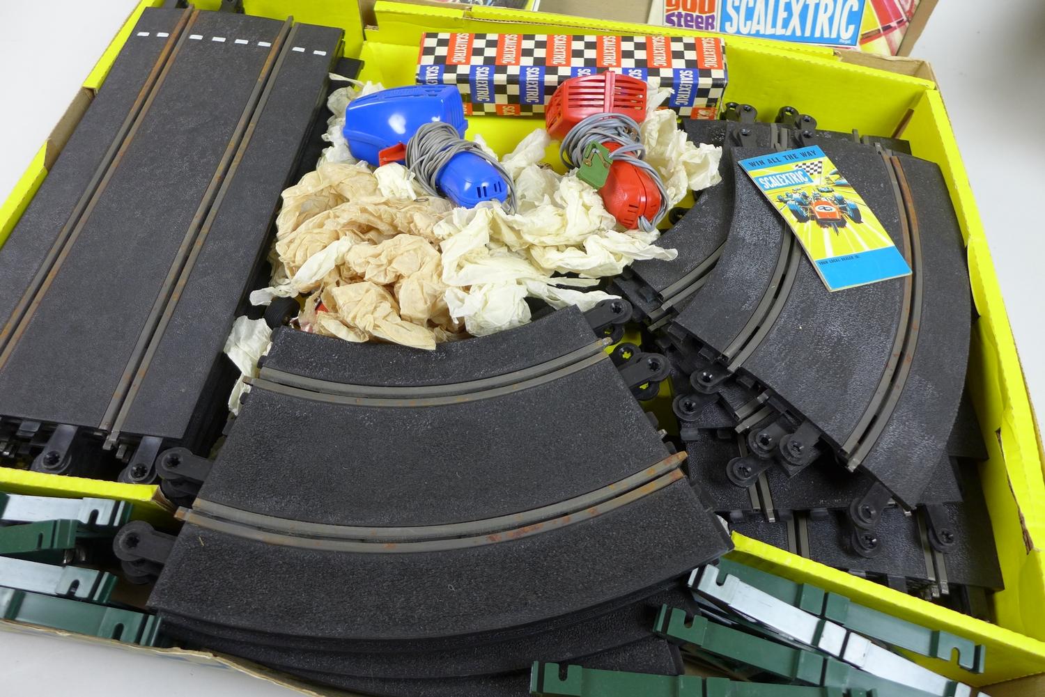 A vintage Scalextric racing set 12E and accessories, with original box including two racing cars, - Image 3 of 6