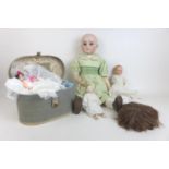 A group of four early 20th century and later dolls, comprising an 'S and C' bisque headed doll, with