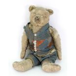 A vintage blonde push Teddy bear, with j