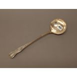 A Victorian silver double struck King's pattern soup ladle, crest engraved, London 1858,