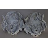 Two lead fountain masks, each cast as a young cherub, 25cm high, (2).