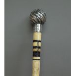 A silver mounted whalebone walking cane, the 'BRIGG' pommel hallmarked London 1898, 91cm, (a.f).