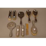 A lady's silver mounted tortoiseshell five piece dressing set, comprising; an oval hand mirror,