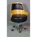 A 20th century beech framed office chair with faux black leather seat.