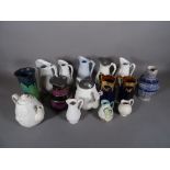 Ceramics; a quantity of Victorian and later ceramic jugs of various designs.