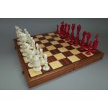 A Chinese 'Macao' stained ivory figural chess set, circa 1860,
