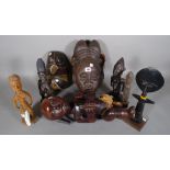 A group of hardwood carved tribal figure masks and sundry, (qty).