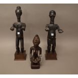 A Congo hardwood carved fertility figure modelled as mother and child,