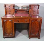 A Victorian mahogany Dickens type desk, with double four drawer Wellington chest superstructure,