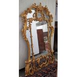 A pair of Victorian gilt framed overmantel mirrors with acanthus scroll frames,