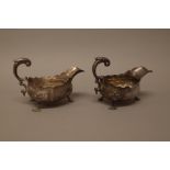 Two similar George III sauceboats, each with a scrolling handle,