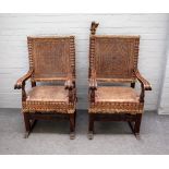 A pair of 18th century Spanish parcel gilt and walnut square back open arm throne chairs on sleigh