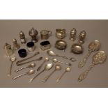 Silver, comprising; six pepperettes, five salts, a mustard pot, a pair of Victorian spoons,