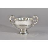 A silver twin handled trophy bowl, raised on a circular foot, diameter 16.