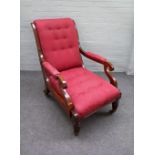 A William IV mahogany library chair with semi-padded open arms on tapering reeded supports,