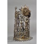 An Inca white metal sun crown, possibly 17th century, surmounted with sun and crescent moon,