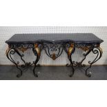A 20th century console, the serpentine marble top over a polished steel and cast brass scroll base,