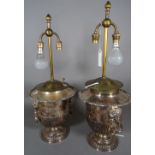 A pair of silver plated urn shaped wine coolers converted to table lamps,
