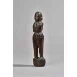 A hardwood carved tribal figure, possibly early 19th century Indian or Asian, (a.f.), 25cm.