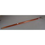 A 20th century mahogany walking stick, the silver plated mount formed as a pangolin,