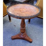 A William IV pollard oak circular occasional table on baluster column and triform base,