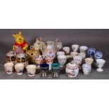Ceramics, including; a large group of mainly 20th century egg cups and honey pots, (qty).