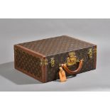 A Louis Vuitton attache case with monogrammed canvas, brass hardware and fitted interior.