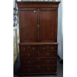A Queen Anne style feather banded walnut linen press, the pair of doors over brushing slide,