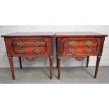 A pair of Empire style gilt metal mounted mahogany two drawer bedside tables,