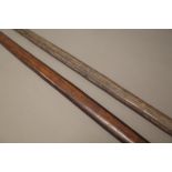 Two New Guinea wooden bows, one with leather bound terminal, (184cm), (2).