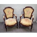 A pair of 19th century mahogany framed open armchairs, on scroll supports, 60cm wide x 99cm high,