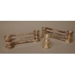 A pair of French plated twin light candle stands, each of triple bar twist over form,