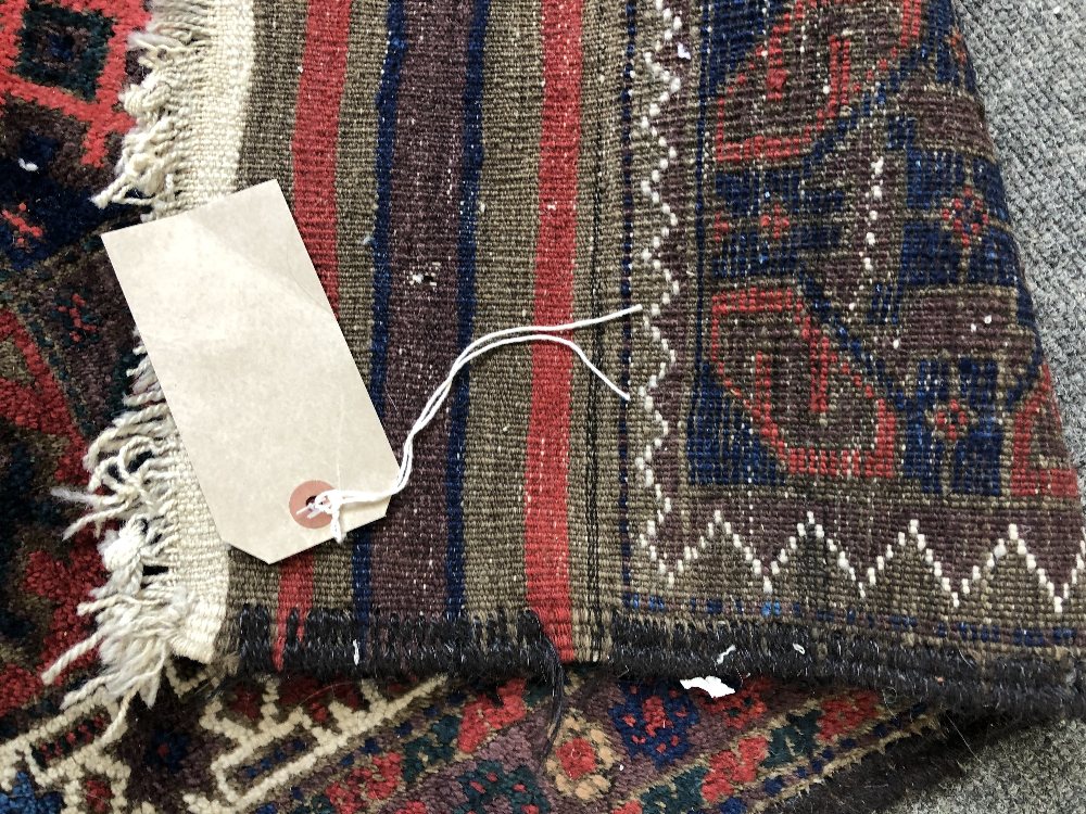 A Persian tribal rug with multicoloured repeating gul design within stepped white borders, - Image 3 of 7