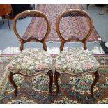 A set of six Victorian balloon back dining chairs, with serpentine seat, 49cm wide x 47cm high, (6).